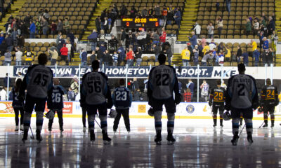 The Milwaukee Admirals stand for the national anthem ahead of a game against the Chicago Wolves.