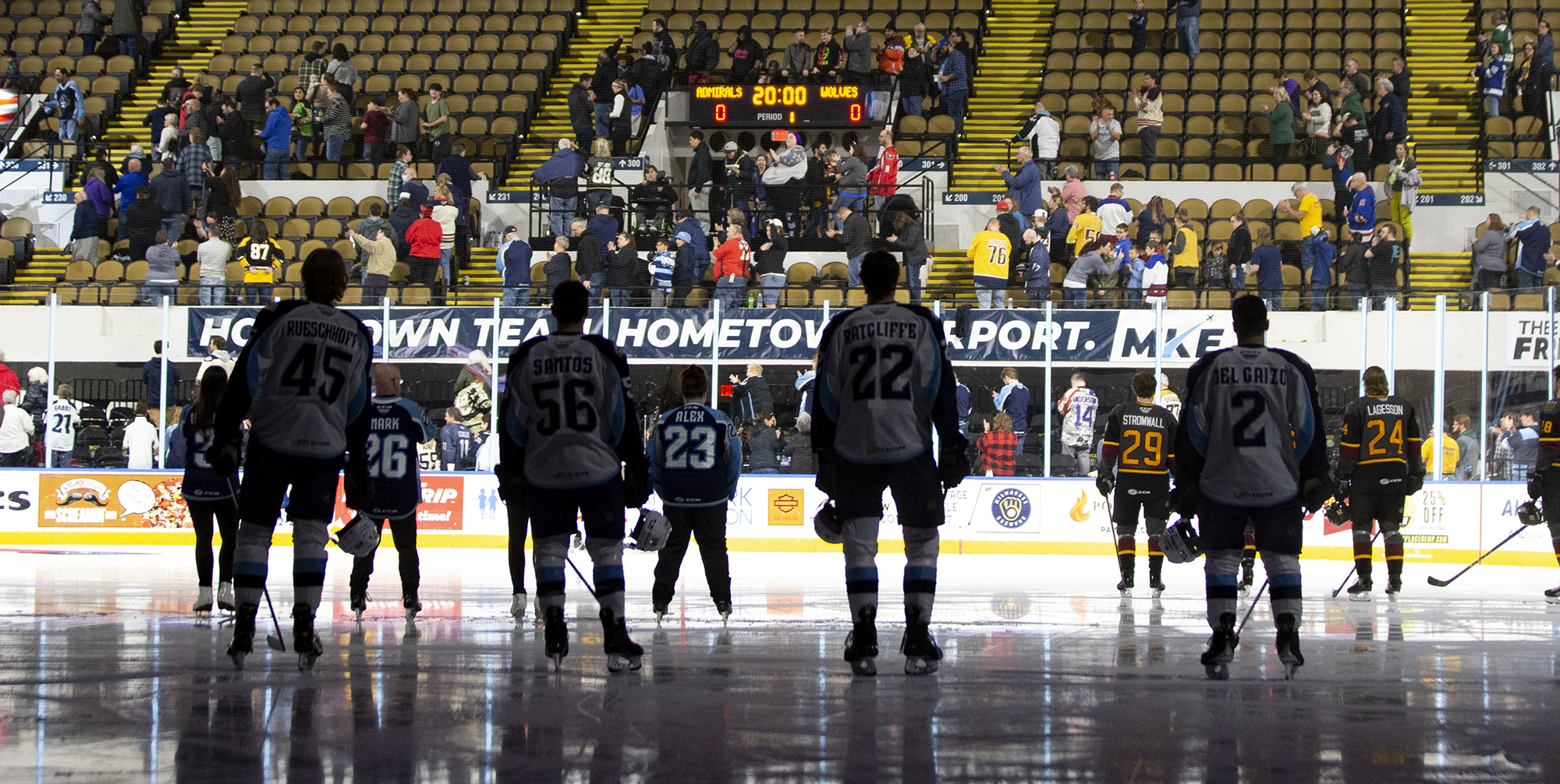 The Milwaukee Admirals stand for the national anthem ahead of a game against the Chicago Wolves.