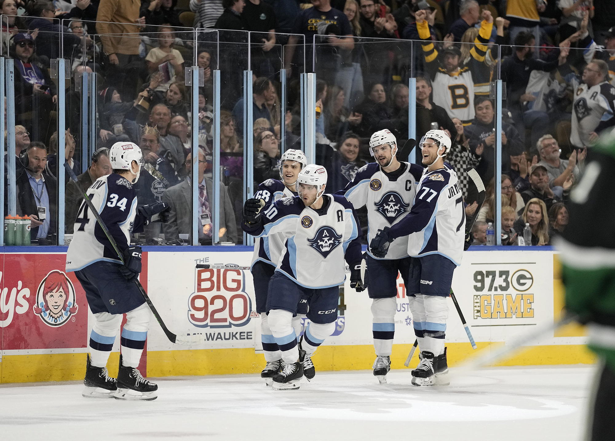 The Milwaukee Admirals celebrate scoring a goal against the Texas Stars.