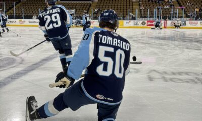 Philip Tomasino warms up with the Milwaukee Admirals