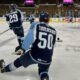 Philip Tomasino warms up with the Milwaukee Admirals