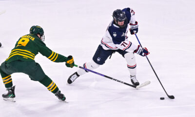 Matthew Wood carries the puck for UConn Men's Hockey.
